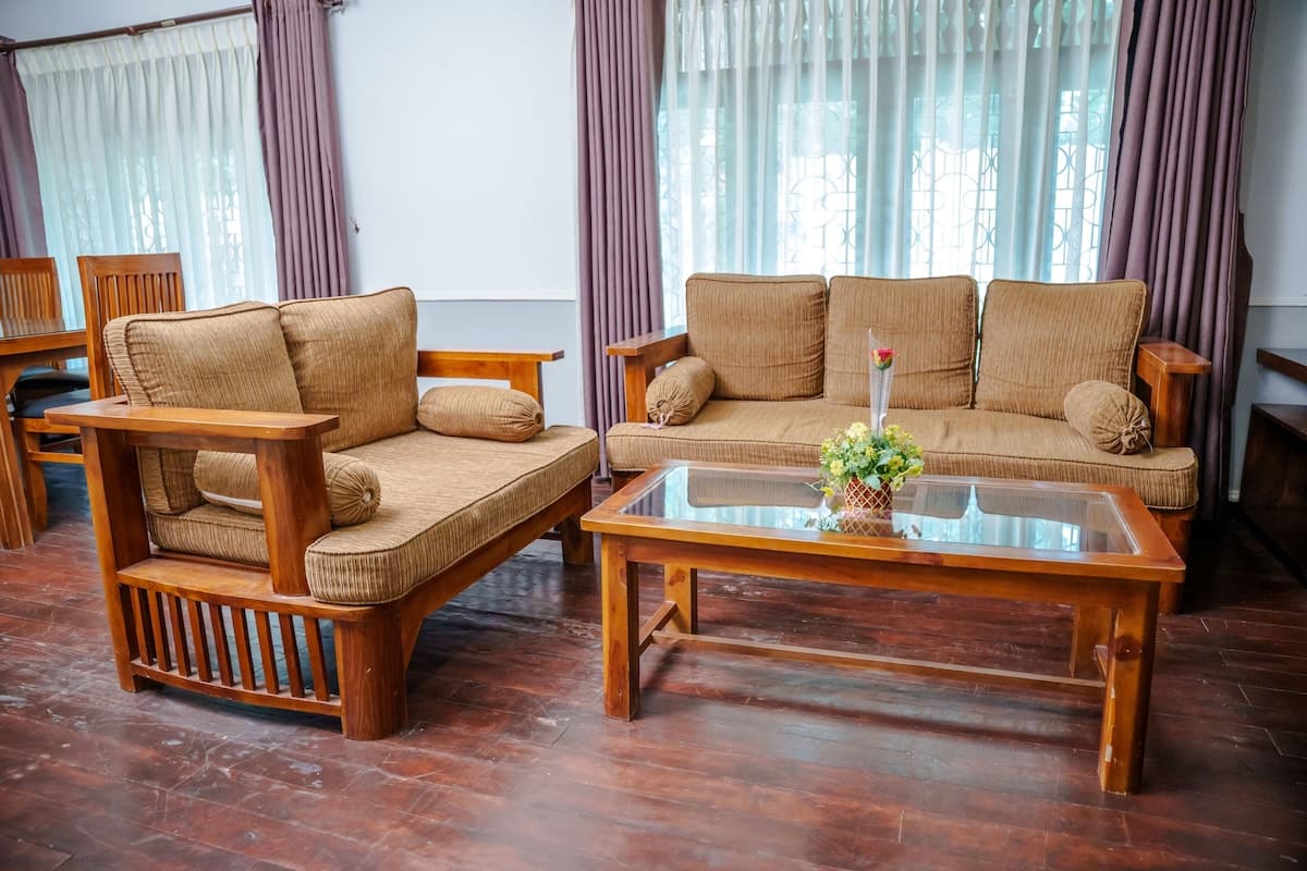 Abi Nila Villa — bedroom with high ceilings and white linen